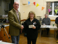 11.01.2011 - Rod Lord - OGAFCA social evening (Nov 26 2010) - Andy James presents Fun Day cheque to Ros Fortescue (Thames Hospicecare)