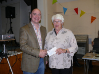 11.01.2011 - Rod Lord - OGAFCA social evening (Nov 26 2010) - Andy James presents Fun Day cheque to Helene (Rosies Rainbow Fund)